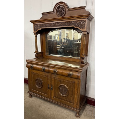 207 - An Art Nouveau carved oak mirrorback sideboard