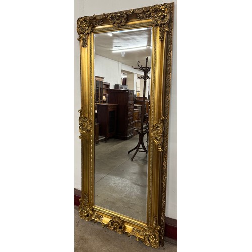 209 - A large French Louis XV style rectangular gilt framed mirror
