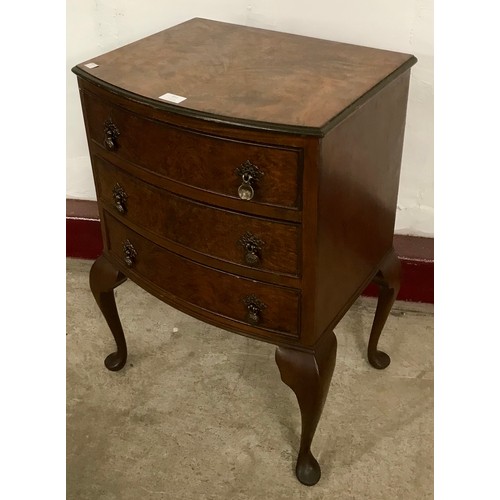 211 - A George III style figured walnut bow front chest of drawers