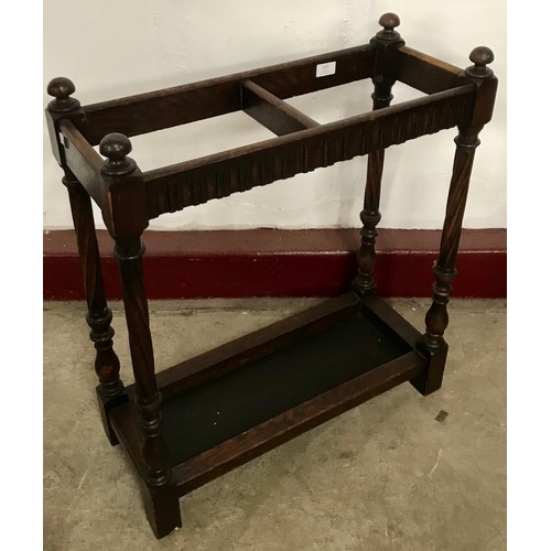 213 - An early 20th Century oak stick stand