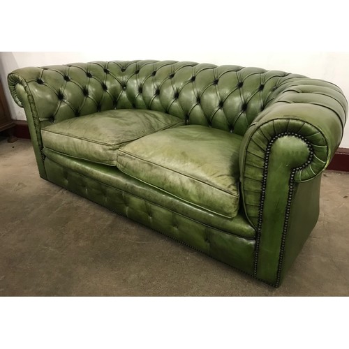 226 - A green leather Chesterfield settee