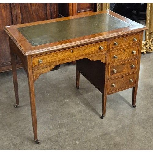 196B - An Edward VII inlaid mahogany and green leather topped desk