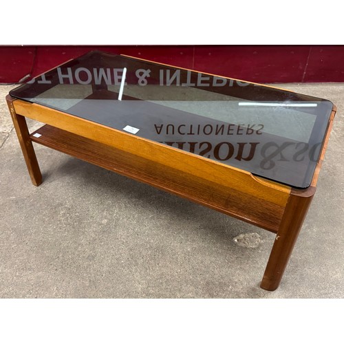 71 - A Myer teak and smoked glass topped rectangular coffee table