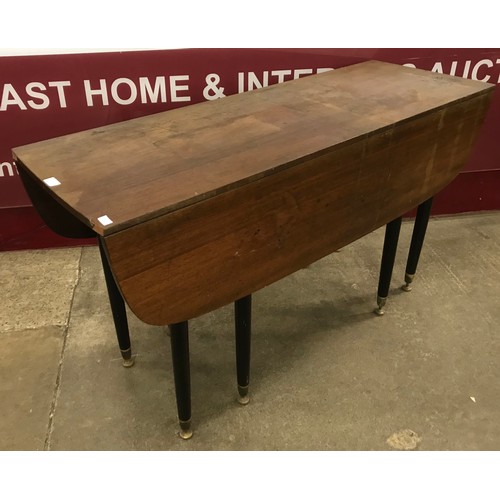69 - A G-Plan Librenza tola wood and black dropleaf table
