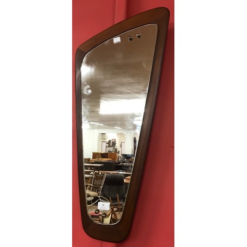 78 - A teak asymmetrical framed mirror