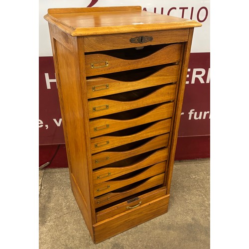 109 - An early 20th Century oak tambour front filing cabinet