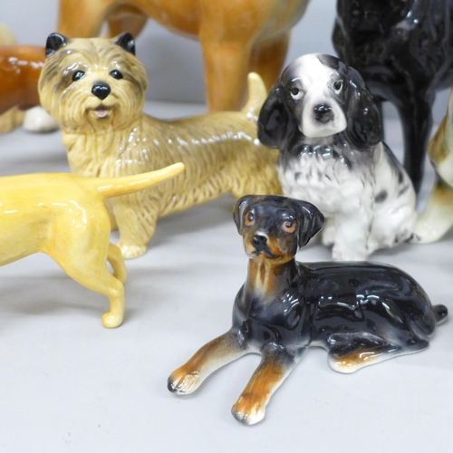 2080 - A collection of dog figures, some Beswick including English Bull Terrier, Coopercraft boxer, Sylvac