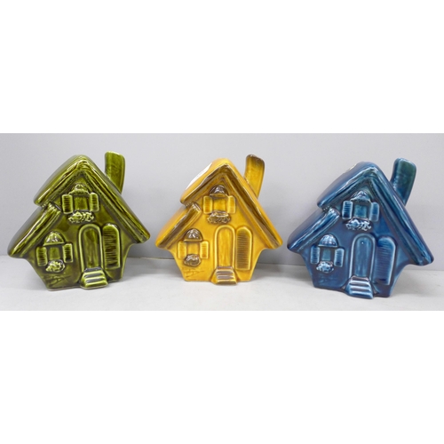 2081 - Three ceramic Trentham Art ware money boxes in the form of houses