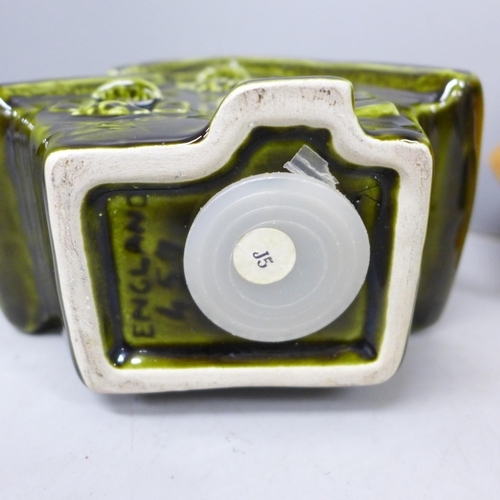 2081 - Three ceramic Trentham Art ware money boxes in the form of houses