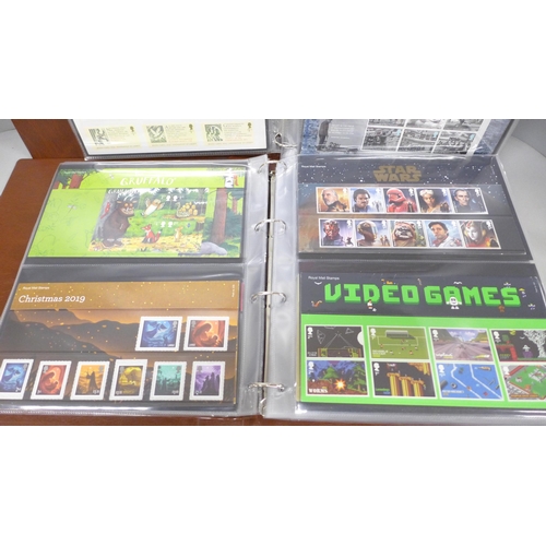 2091 - Stamps; two albums of Royal Mail presentation packs, some examples include Marvel, Aardman, D-Day an... 