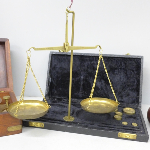2093 - A German made barometer, a Lifeboats Sundial Compass and a set of balance scales