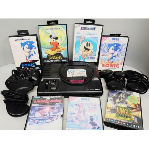 2109 - A Sega Mega Drive together with games including Sonic, Fantasia, Pac Mania, etc., with controllers