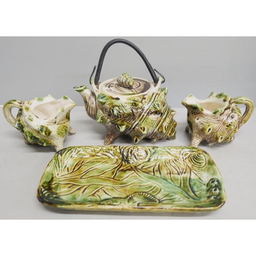 2111 - A conch shell shaped teapot and two milk jugs, a Sylvac dog figure and a collection of silver plated... 