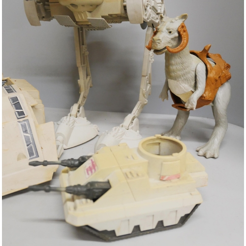 2114 - A collection of early Kenner Star Wars figures, together with some vehicles