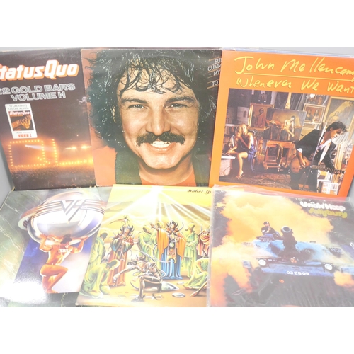 2132 - Twenty-four rock and metal vinyl LP records, including Dire Straits, Yes, Status Quo, Santana, Saxon... 
