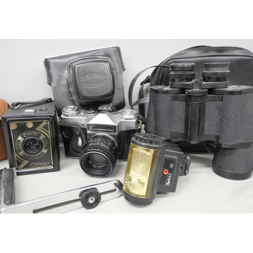 2133 - A Zenit-E camera No. 73215752, a vintage Coronet box camera and a pair of binoculars, camera accesso... 