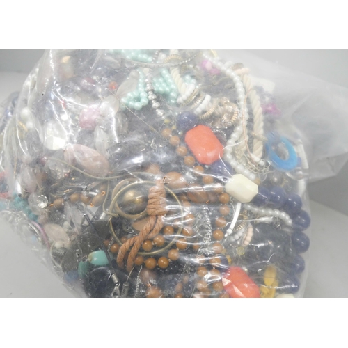 2145 - A large bag of costume jewellery