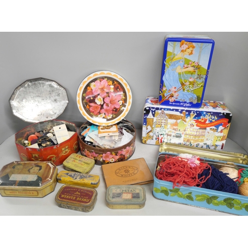 2165 - A collection of vintage tins including three with a collection of buttons