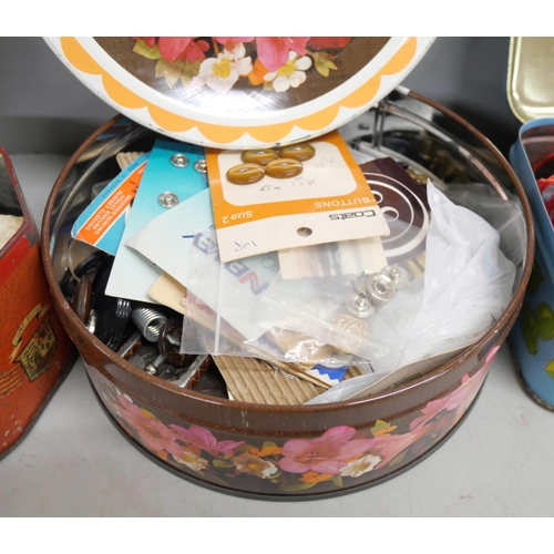 2165 - A collection of vintage tins including three with a collection of buttons