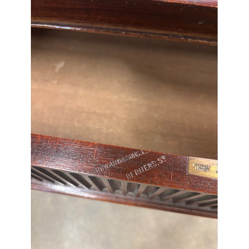 113 - A late Victorian Howard & Sons mahogany two drawer writing table