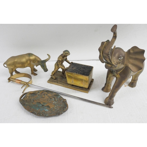 2311 - A collection of brass items comprising of an elephant, coal miner, water buffalo, fire poker sword a... 