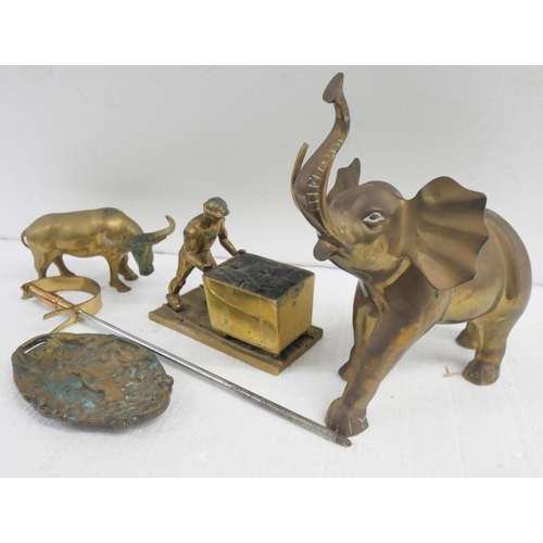 2311 - A collection of brass items comprising of an elephant, coal miner, water buffalo, fire poker sword a... 