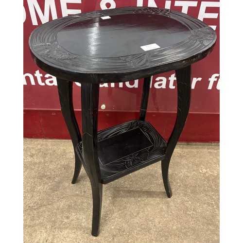 115 - An Arts & Crafts Liberty & Co. style ebonised Japanese range occasional table