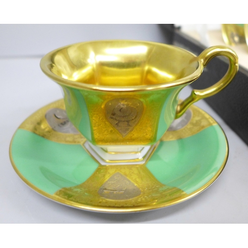 2096 - A Czechoslovakian Schlaggenwald six piece coffee set in green with gilt detail, case marked Thomas M... 