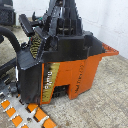 5193A - Three petrol garden tools - A Challenge Xtreme QJB23 22.5cc hedge trimmer, a Flymo MaxiTrim 430 stri... 