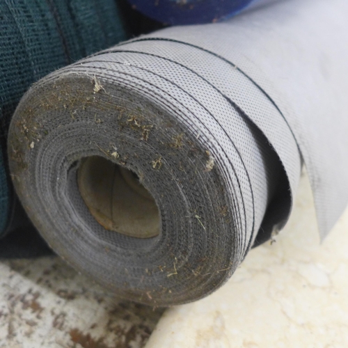 5196 - A large roll of green net, roll of blue wrap and roll of grey weed membrane