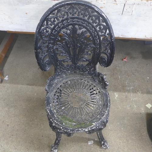 5199 - A painted metal garden chair and circular plastic plant pot with plant