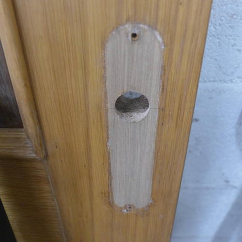 5201 - An 80 x 205cm oak door and 3 panes of glass