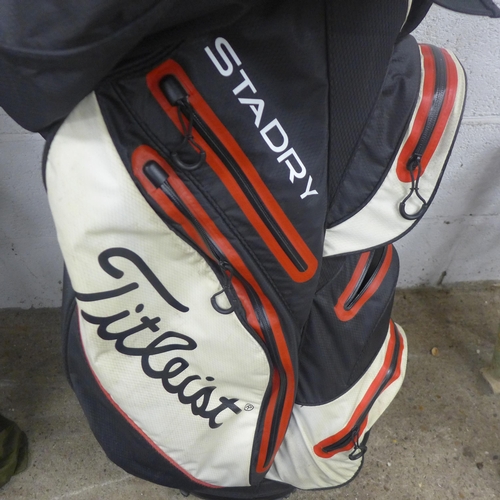 5207 - A Titleist golf bag, a quantity of assorted clubs including Fazer, Top-Flite, Adams, etc., and a bag... 