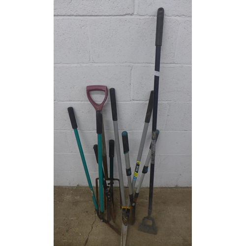 5212 - A quantity of garden tools, fork, loppers, etc.