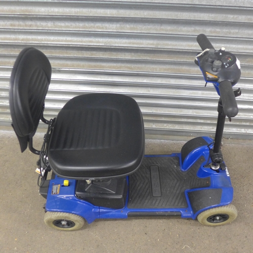 5219 - A Pride Mobility Go-Go compact mobility scooter with key and charger