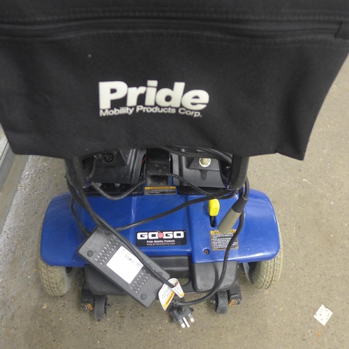 5219 - A Pride Mobility Go-Go compact mobility scooter with key and charger