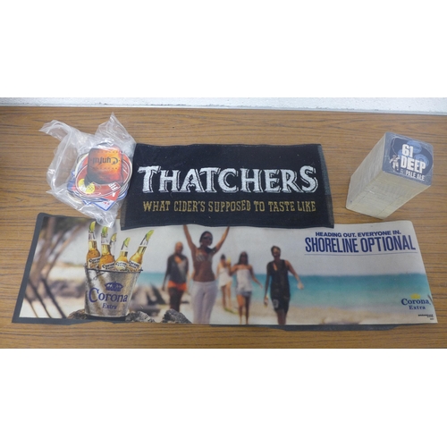 5237 - A box containing pub memorabilia (pump clips, fish eyes, beer mats, bar runners)