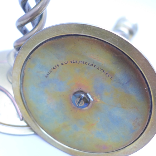 2069 - A pair of Victorian Gothic Revival brass open-twist candlesticks, each set with three cabochon malac... 