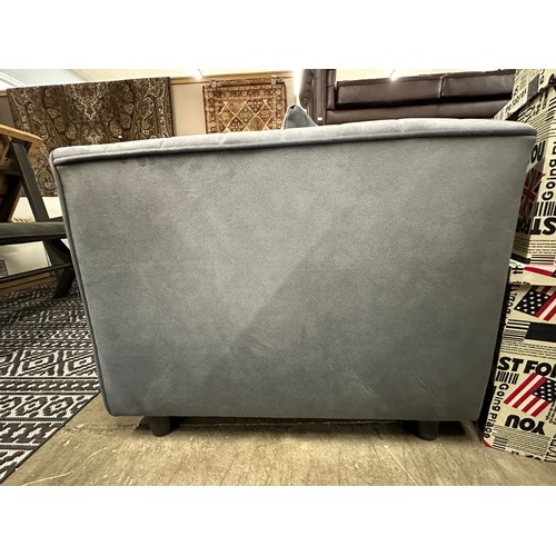 3037 - A dark grey velvet upholstered 2 seater sofa