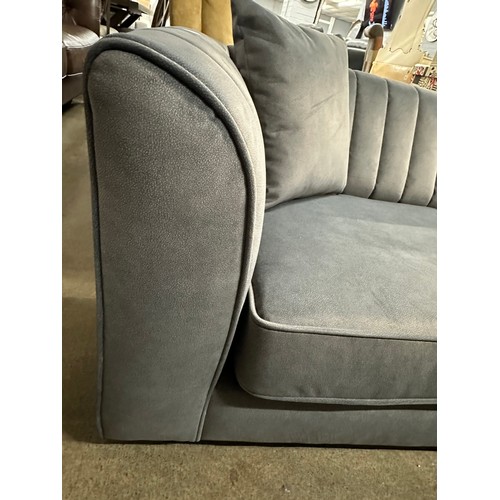 3037 - A dark grey velvet upholstered 2 seater sofa