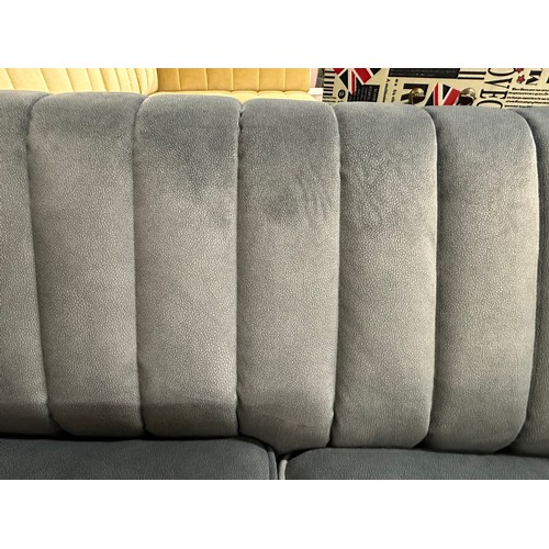 3037 - A dark grey velvet upholstered 2 seater sofa