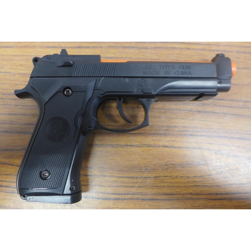 5078 - A toy spring loaded Berretta M92 toy gun and a box of various household items including stuffed elep... 