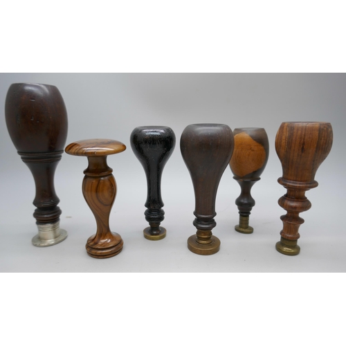 2104 - A collection of turned wooden handled wax seals, examples with coat of arms and stag. Tallest measur... 