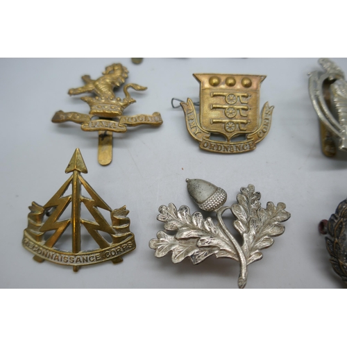 2121 - Twelve assorted military vintage cap badges