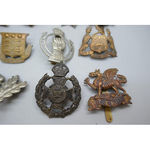 2121 - Twelve assorted military vintage cap badges