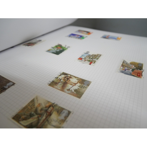 2158 - A large collection of 20th Century stamps including four albums and loose. Together with Stanley Gib... 