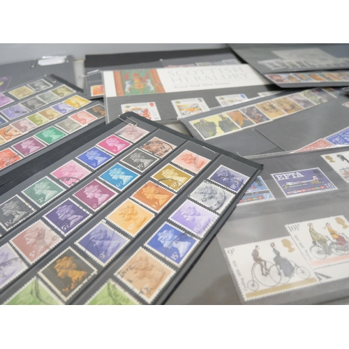 2158 - A large collection of 20th Century stamps including four albums and loose. Together with Stanley Gib... 