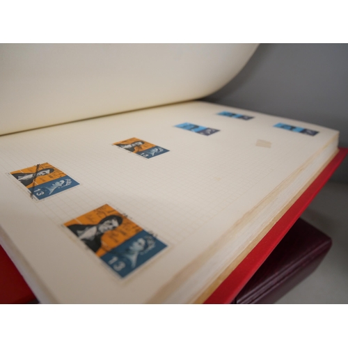 2158 - A large collection of 20th Century stamps including four albums and loose. Together with Stanley Gib... 