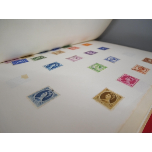 2158 - A large collection of 20th Century stamps including four albums and loose. Together with Stanley Gib... 
