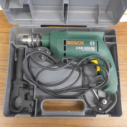 5009 - A Bosch CSB 550RF, 240V hammer drill and 2 drill bit sets
